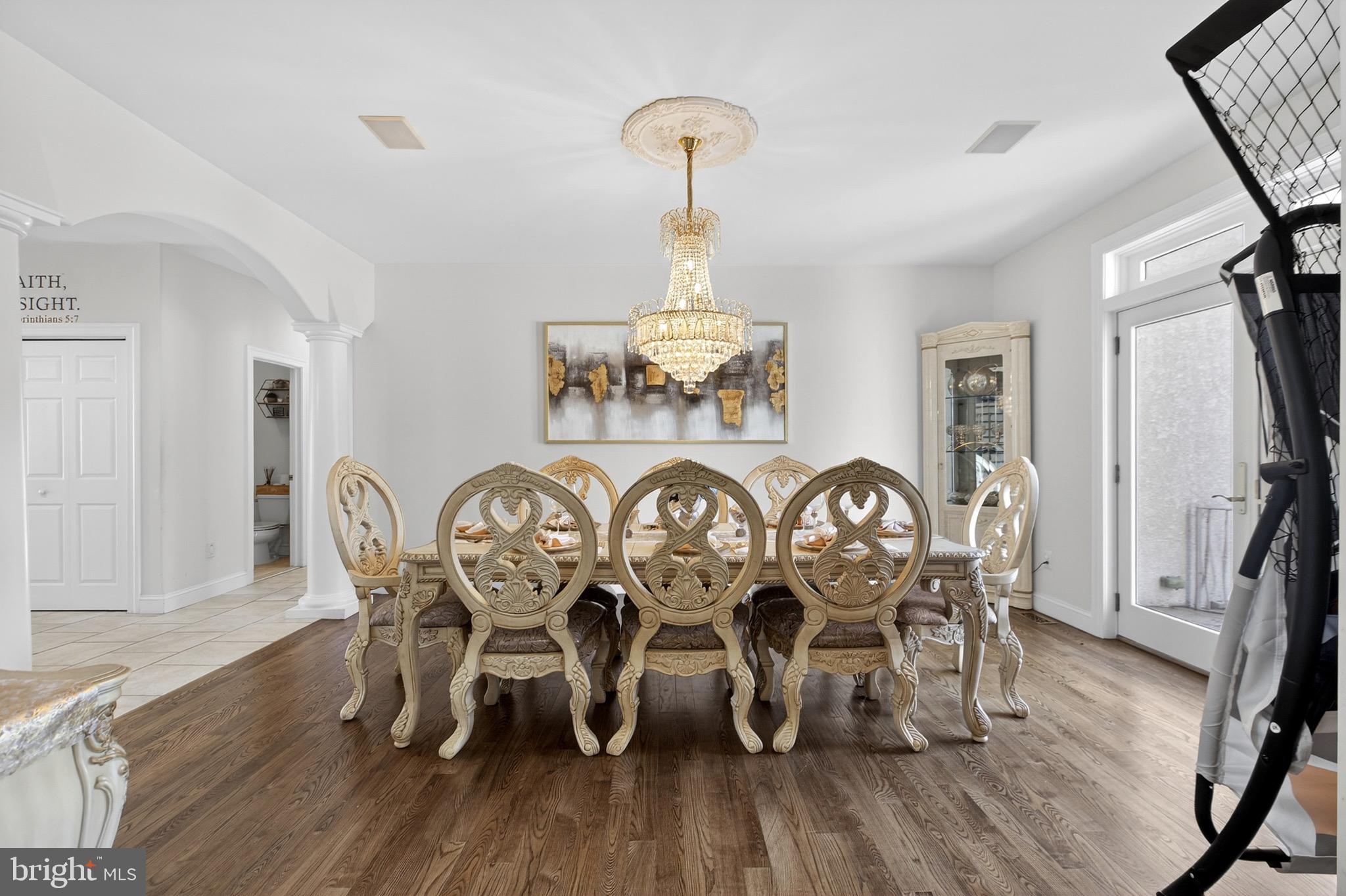 164 Old New York Road Absecon, NJ 08205 - Photo 17 of 81 a view of a dining room with furniture wooden floor and chandelier