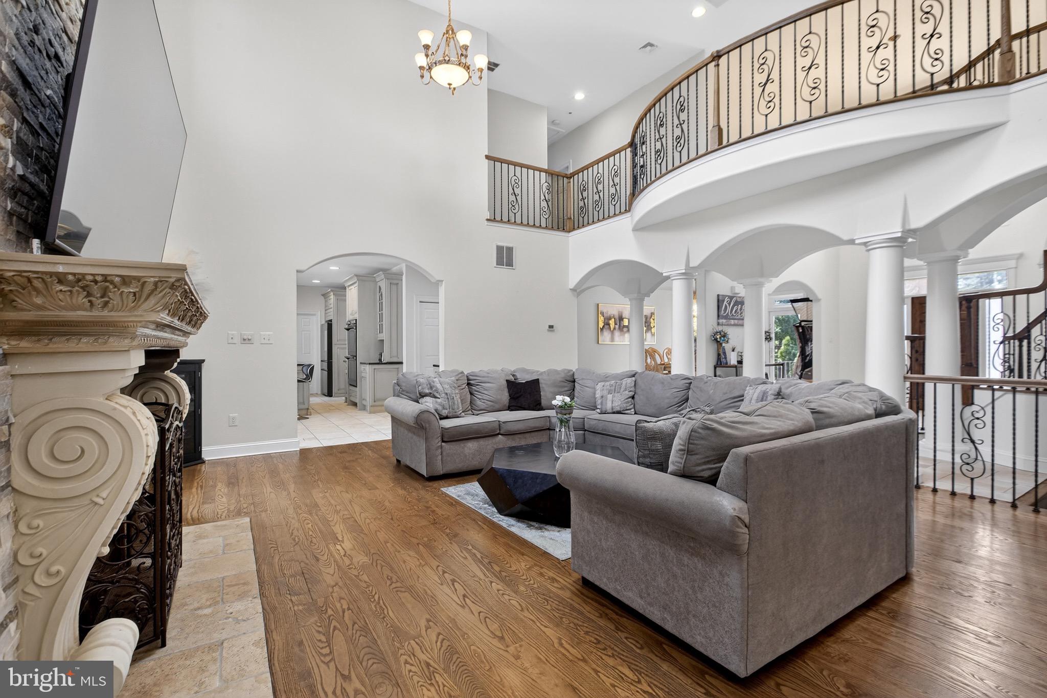 164 Old New York Road Absecon, NJ 08205 - Photo 21 of 81 a living room with furniture a fireplace and wooden floor