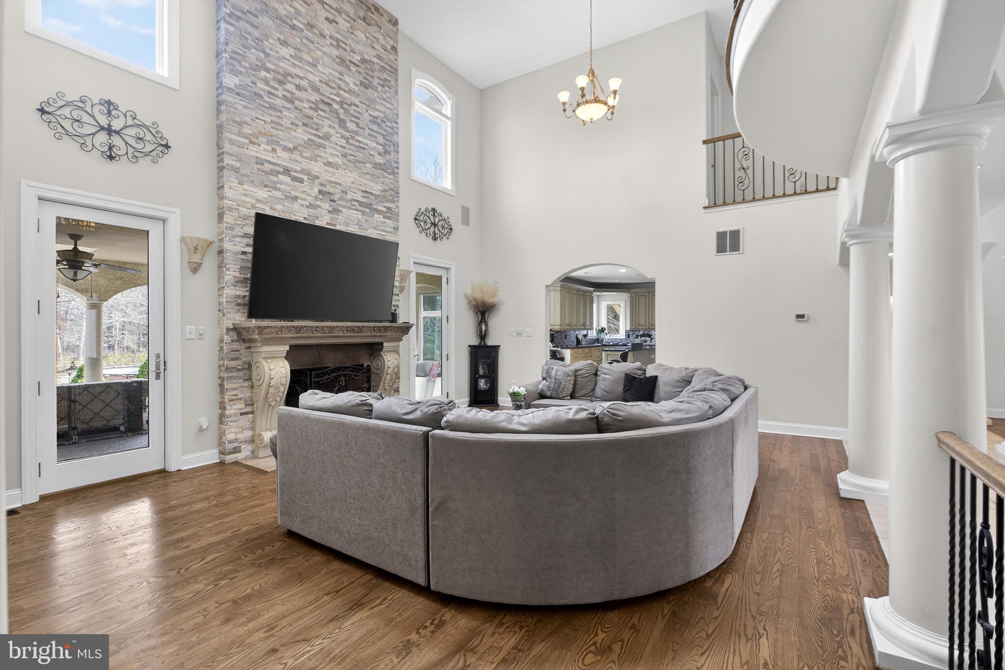164 Old New York Road Absecon, NJ 08205 - Photo 22 of 81 a living room with furniture a fireplace and a flat screen tv