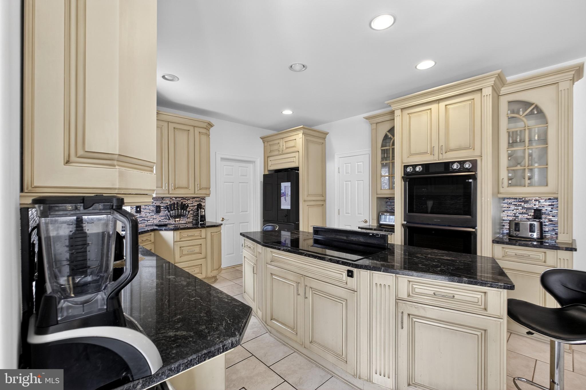 164 Old New York Road Absecon, NJ 08205 - Photo 24 of 81 a kitchen with granite countertop a stove a sink and a microwave