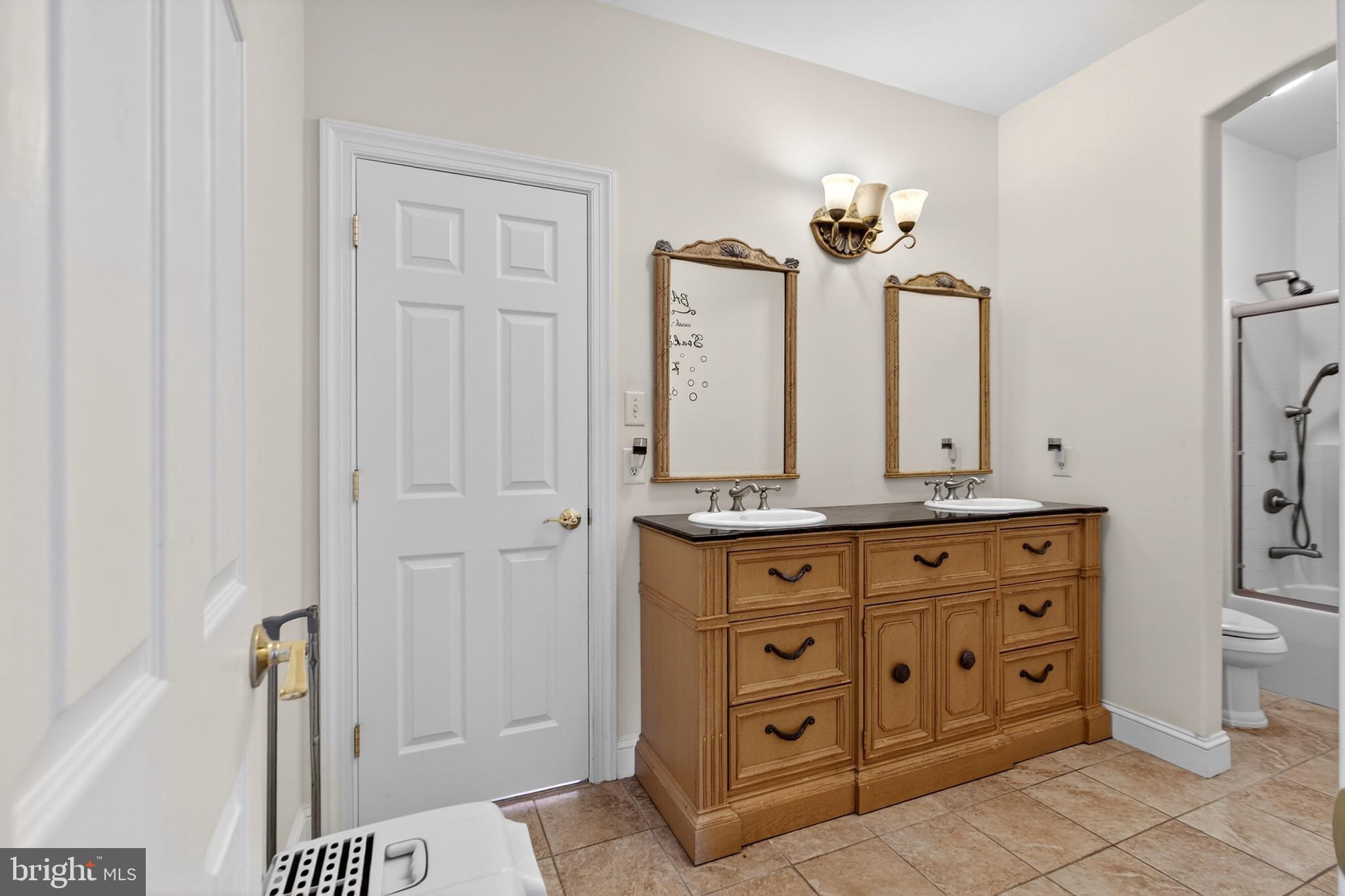 164 Old New York Road Absecon, NJ 08205 - Photo 51 of 81 a bathroom with a granite countertop sink a mirror and a vanity