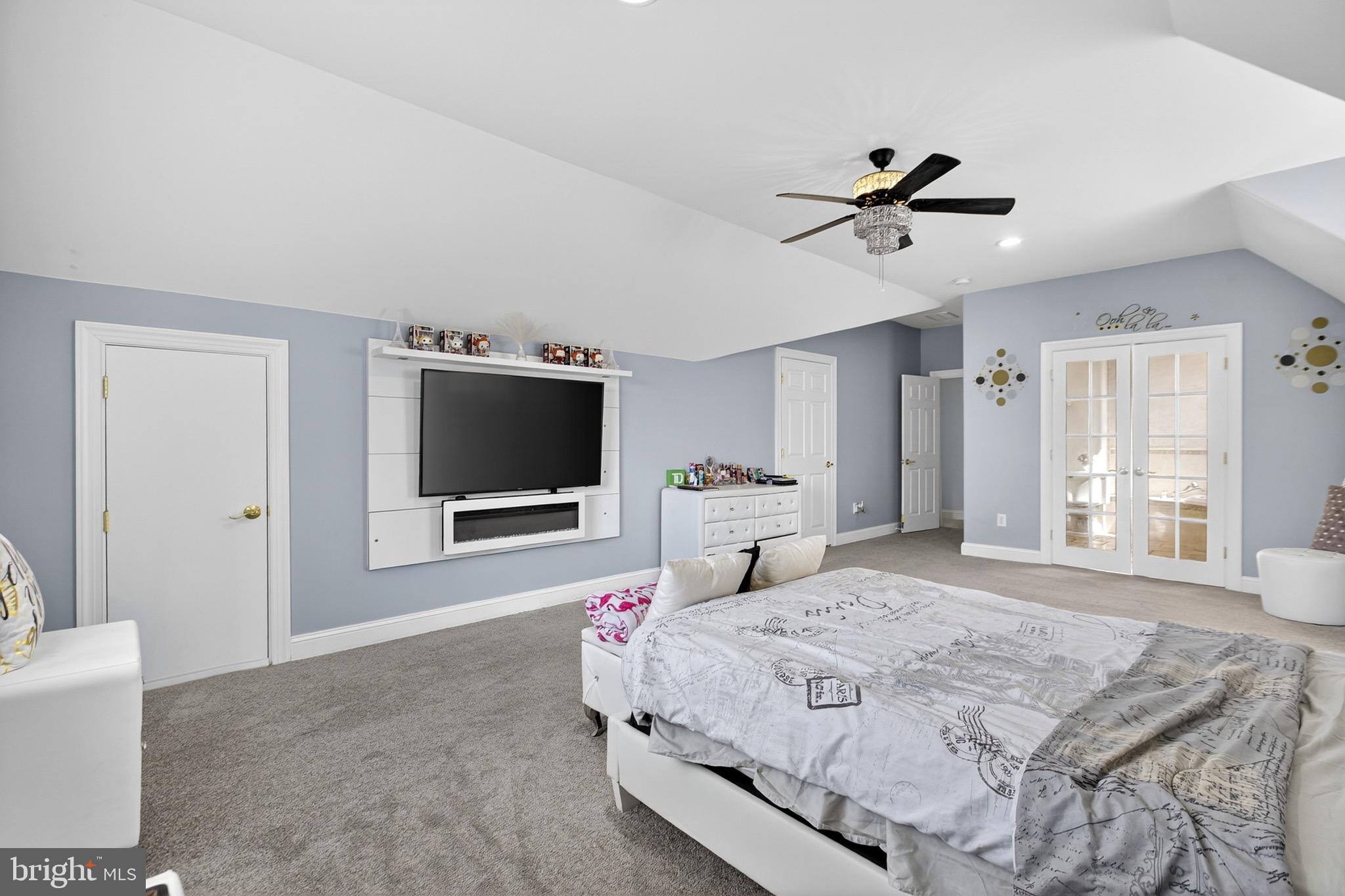 164 Old New York Road Absecon, NJ 08205 - Photo 57 of 81 a bedroom with a large bed and a flat screen tv