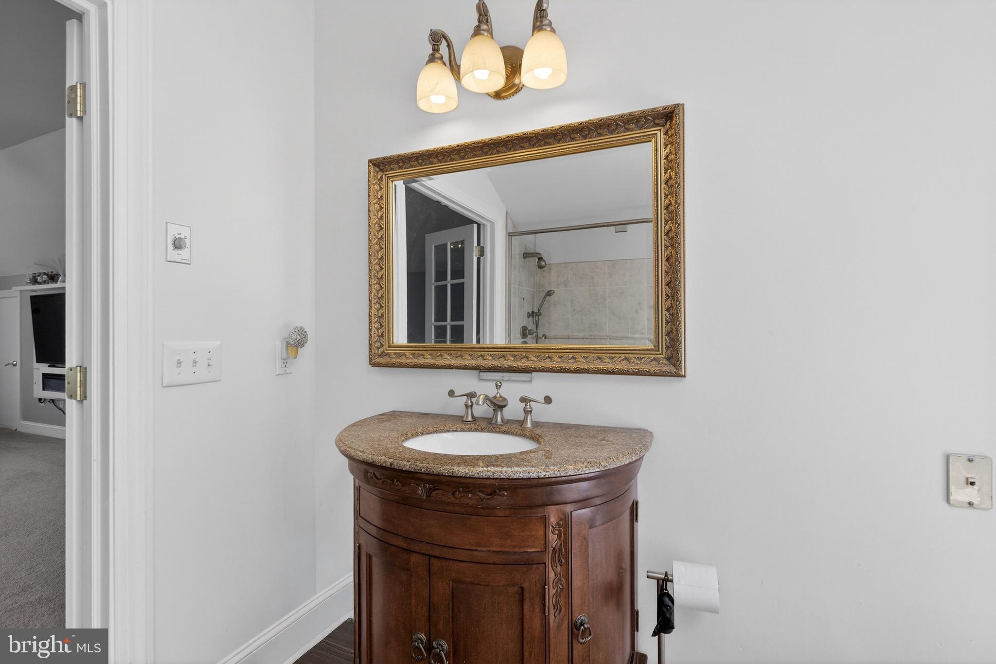 164 Old New York Road Absecon, NJ 08205 - Photo 59 of 81 a bathroom with a sink and a mirror