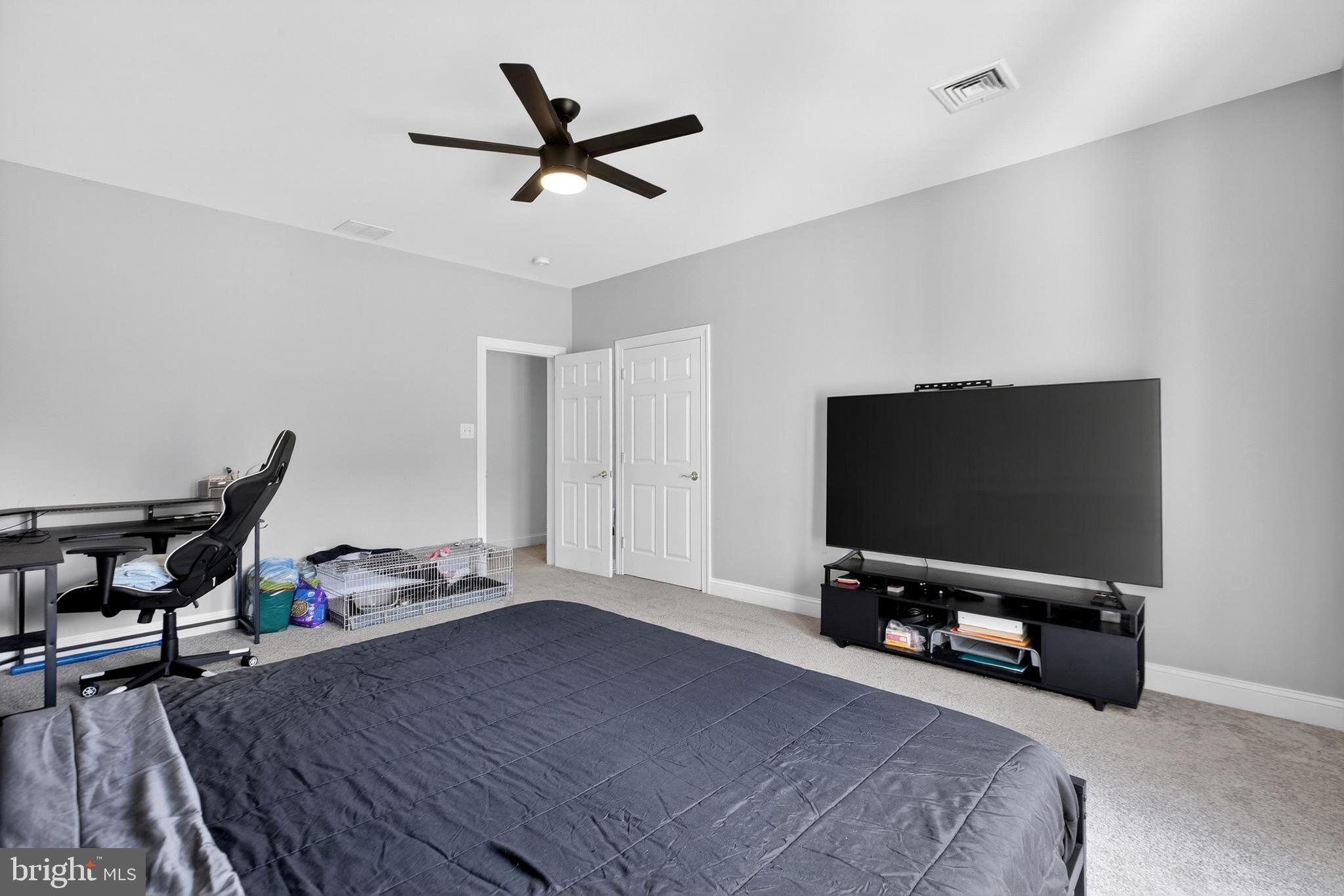164 Old New York Road Absecon, NJ 08205 - Photo 62 of 81 a bedroom with a bed and a flat screen tv