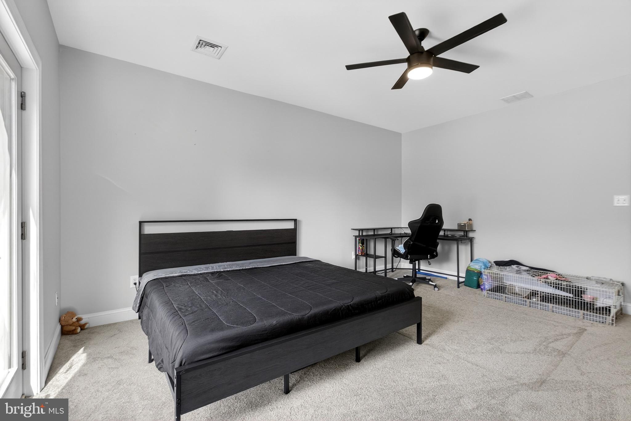 164 Old New York Road Absecon, NJ 08205 - Photo 63 of 81 a bedroom with a bed and a chandelier
