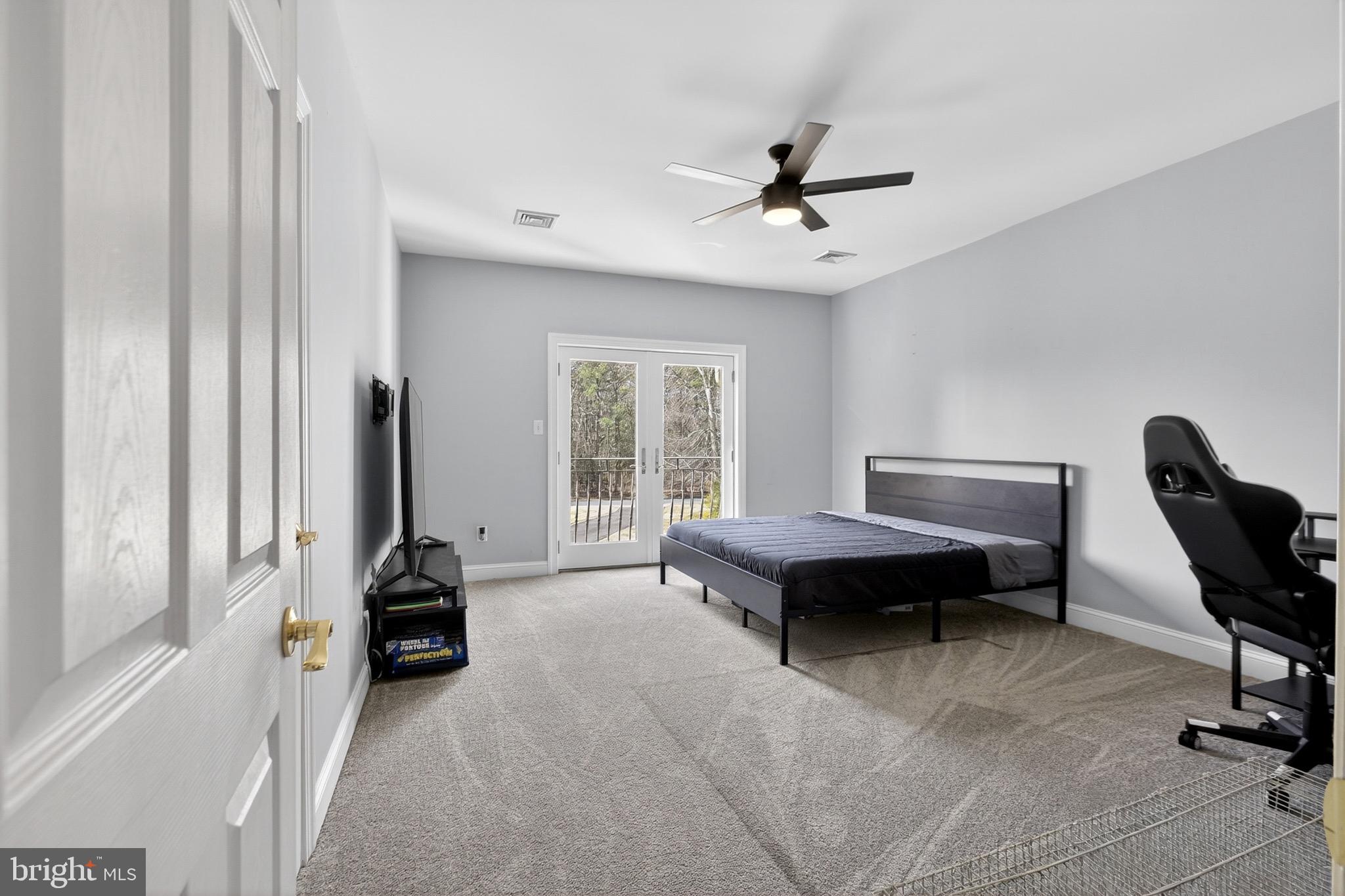 164 Old New York Road Absecon, NJ 08205 - Photo 64 of 81 a living room with furniture a ceiling fan and a window