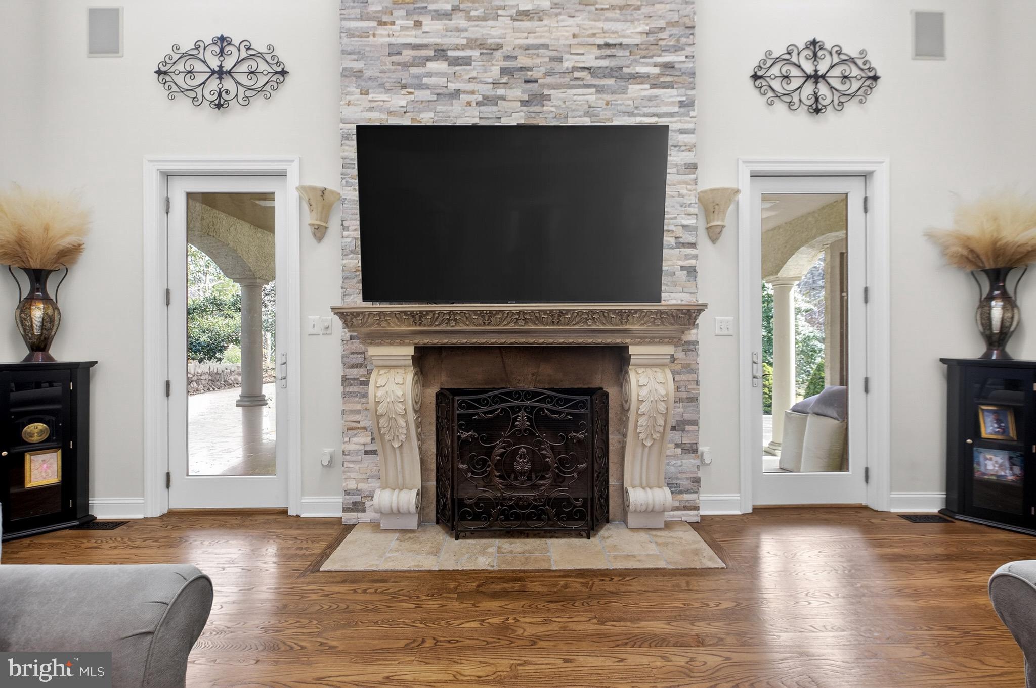 164 Old New York Road Absecon, NJ 08205 - Photo 7 of 81 a living room with a fireplace and a flat screen tv