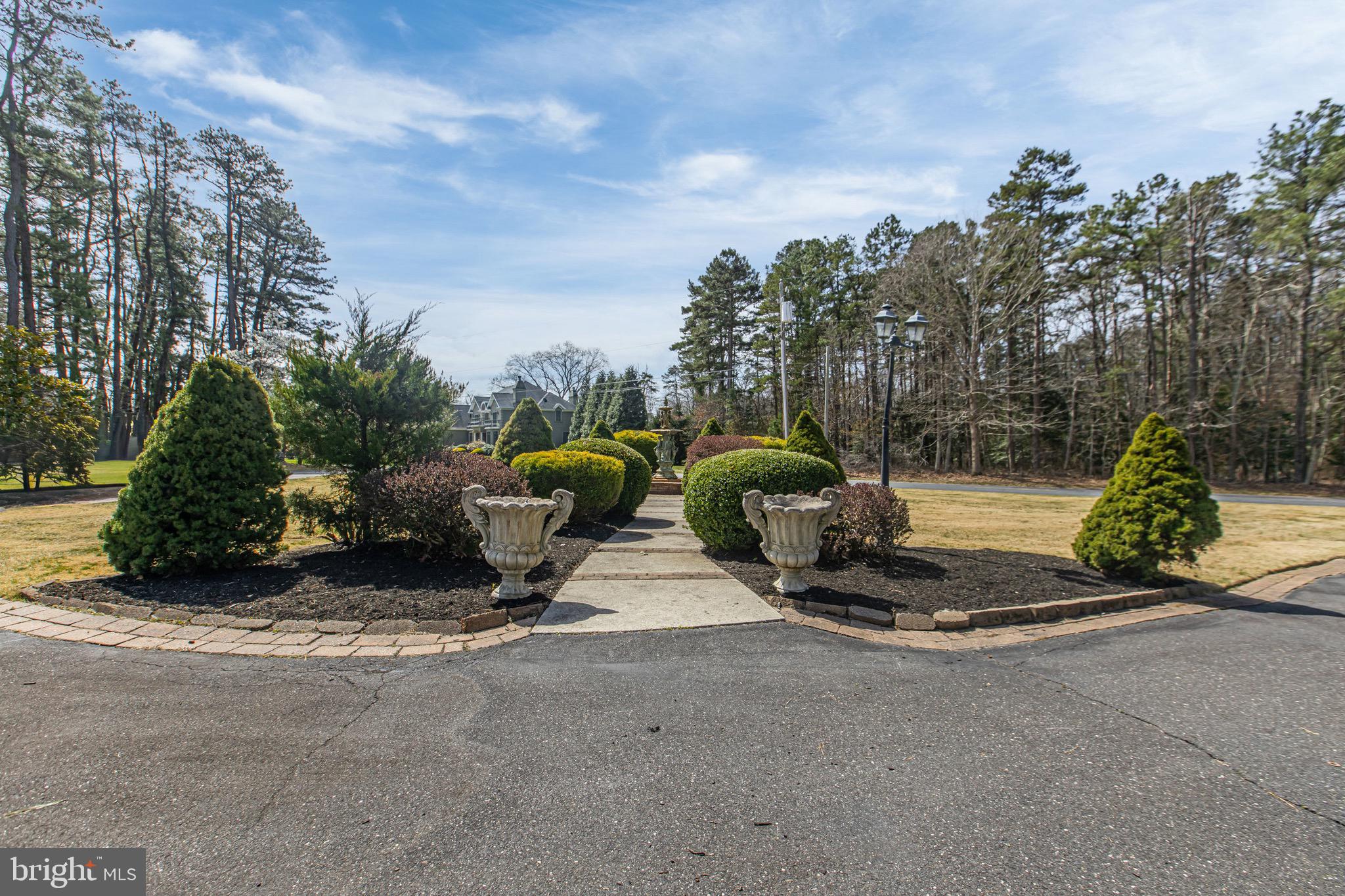 164 Old New York Road Absecon, NJ 08205 - Photo 75 of 81 a view of a park with potted plants and large trees