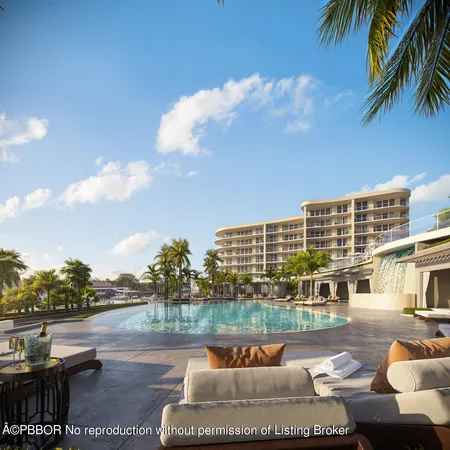 a view of swimming pool with outdoor seating and city view
