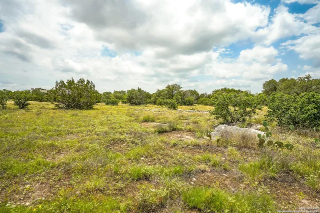 a view of swimming pool with an outdoor seating