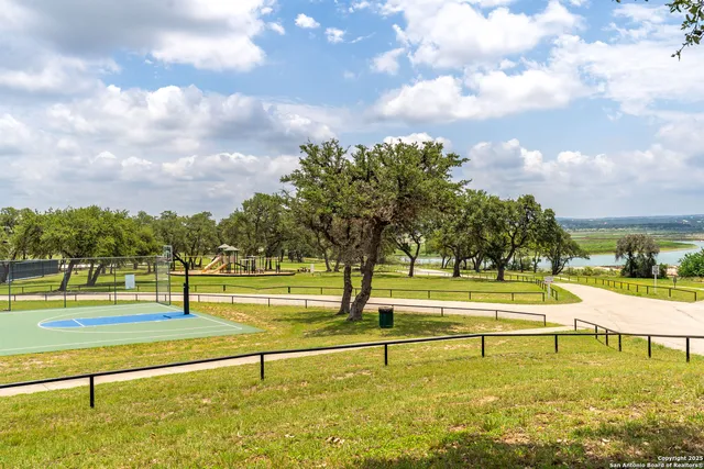 a view of a swimming pool with a lounge chairs