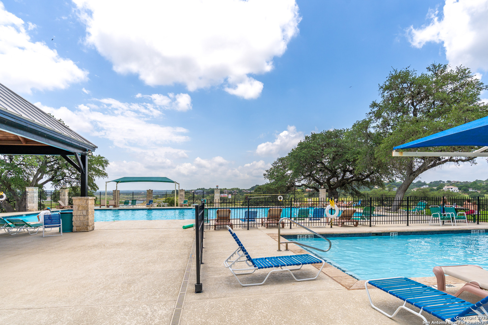 473 Mystic Parkway Spring Branch, TX 78070 - Photo 21 of 23 a view of a swimming pool with a lounge chairs