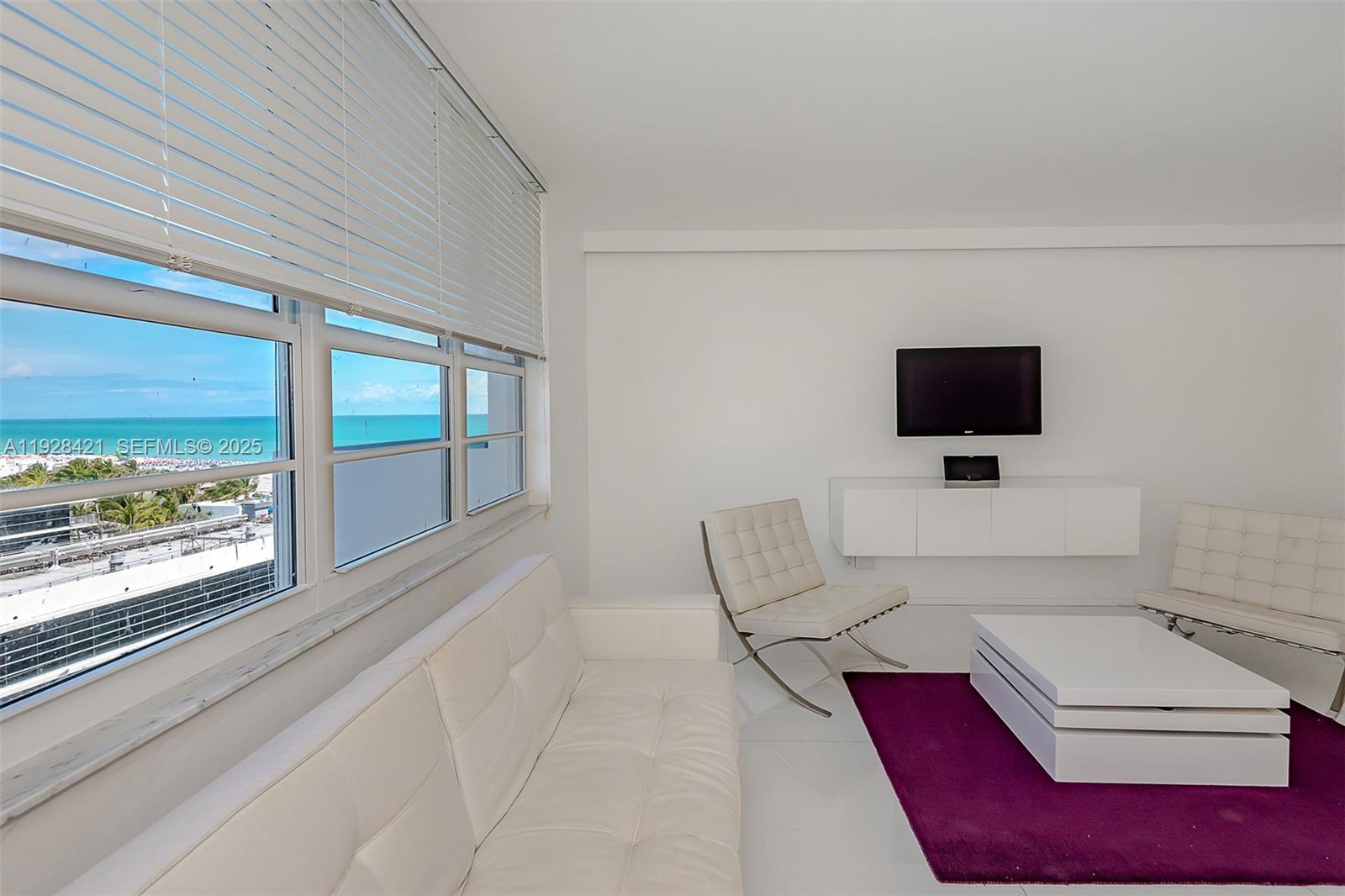 100 Lincoln Road, Unit 839 Miami Beach, FL 33139 - Photo 11 of 26 a living room with furniture and a flat screen tv