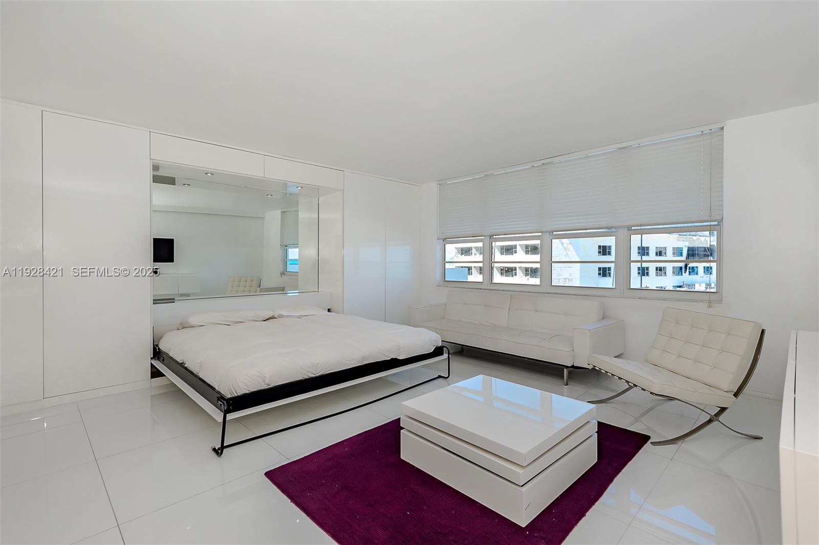 100 Lincoln Road, Unit 839 Miami Beach, FL 33139 - Photo 15 of 26 a living room with furniture and a window