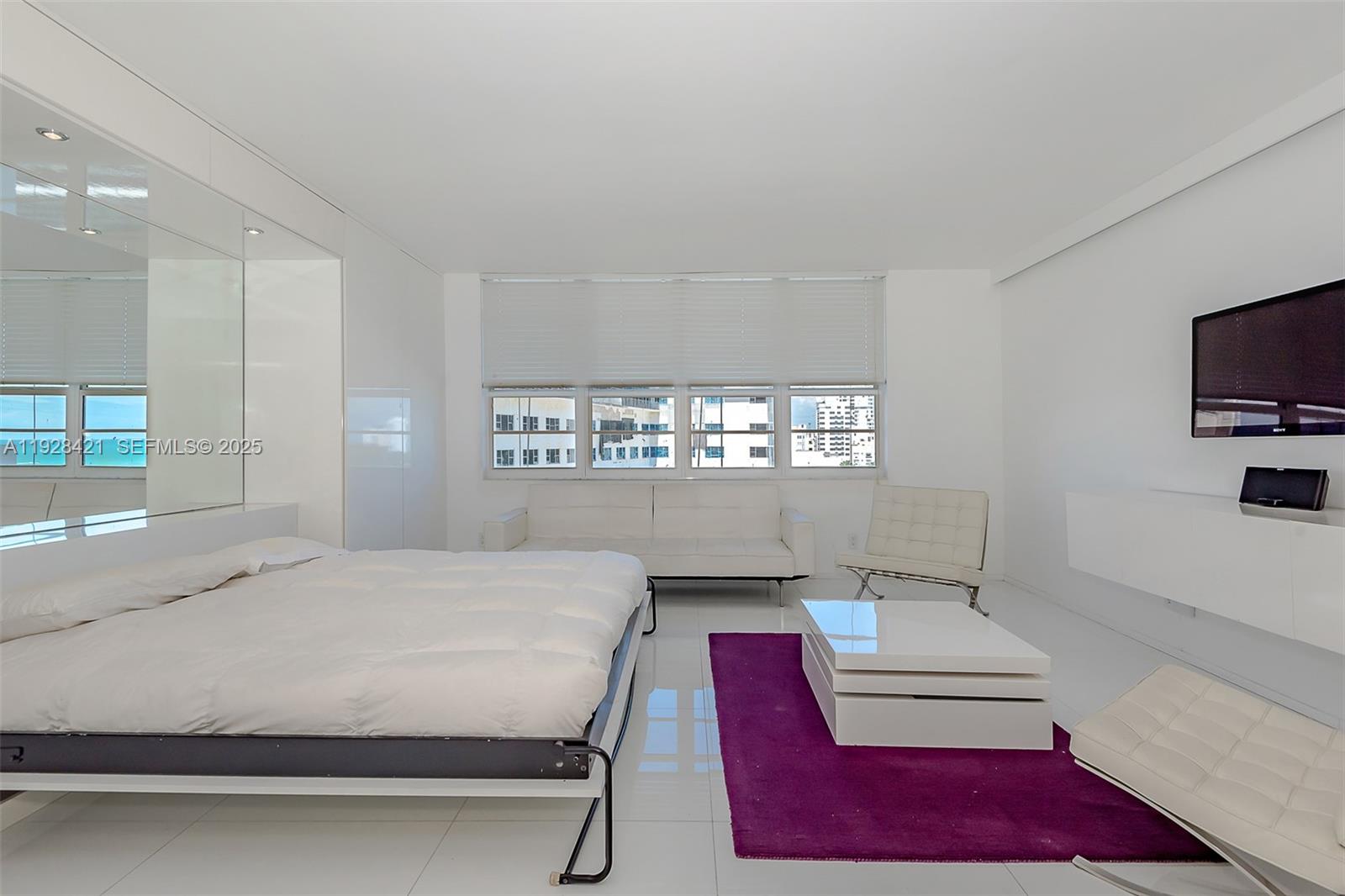100 Lincoln Road, Unit 839 Miami Beach, FL 33139 - Photo 16 of 26 a bedroom with a bed and a flat screen tv