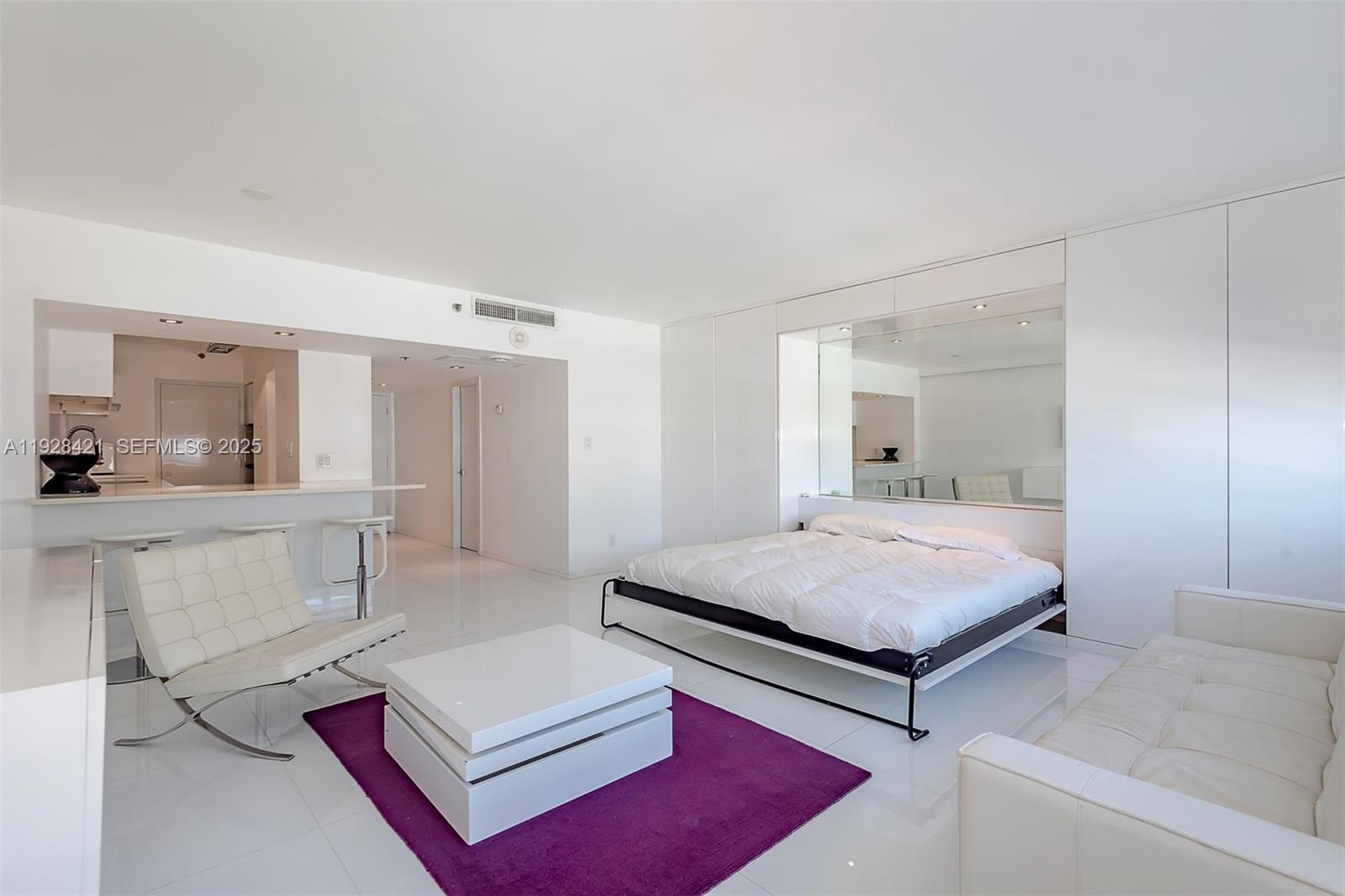 100 Lincoln Road, Unit 839 Miami Beach, FL 33139 - Photo 20 of 26 a living room with furniture and a table