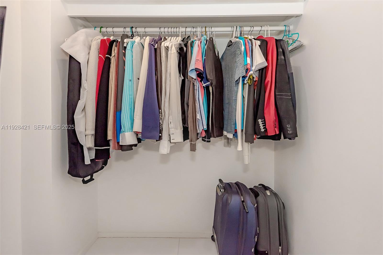 100 Lincoln Road, Unit 839 Miami Beach, FL 33139 - Photo 24 of 26 a view of walk in closet with clothes