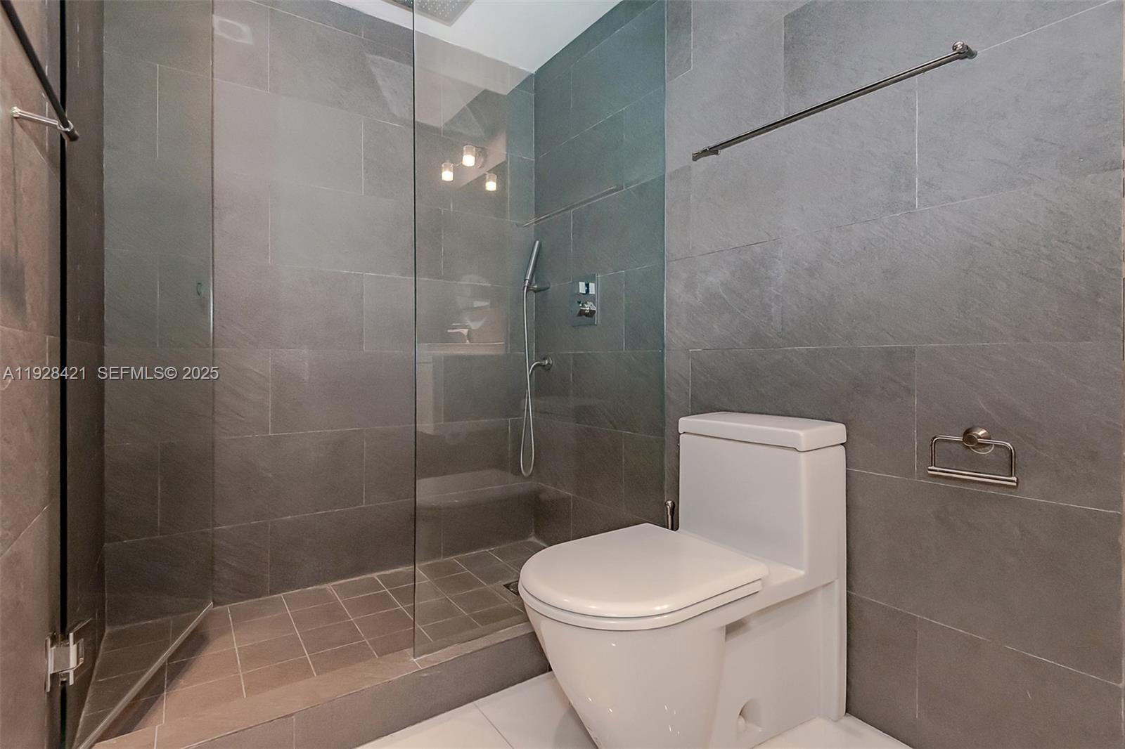 100 Lincoln Road, Unit 839 Miami Beach, FL 33139 - Photo 26 of 26 a white toilet sitting next to a shower