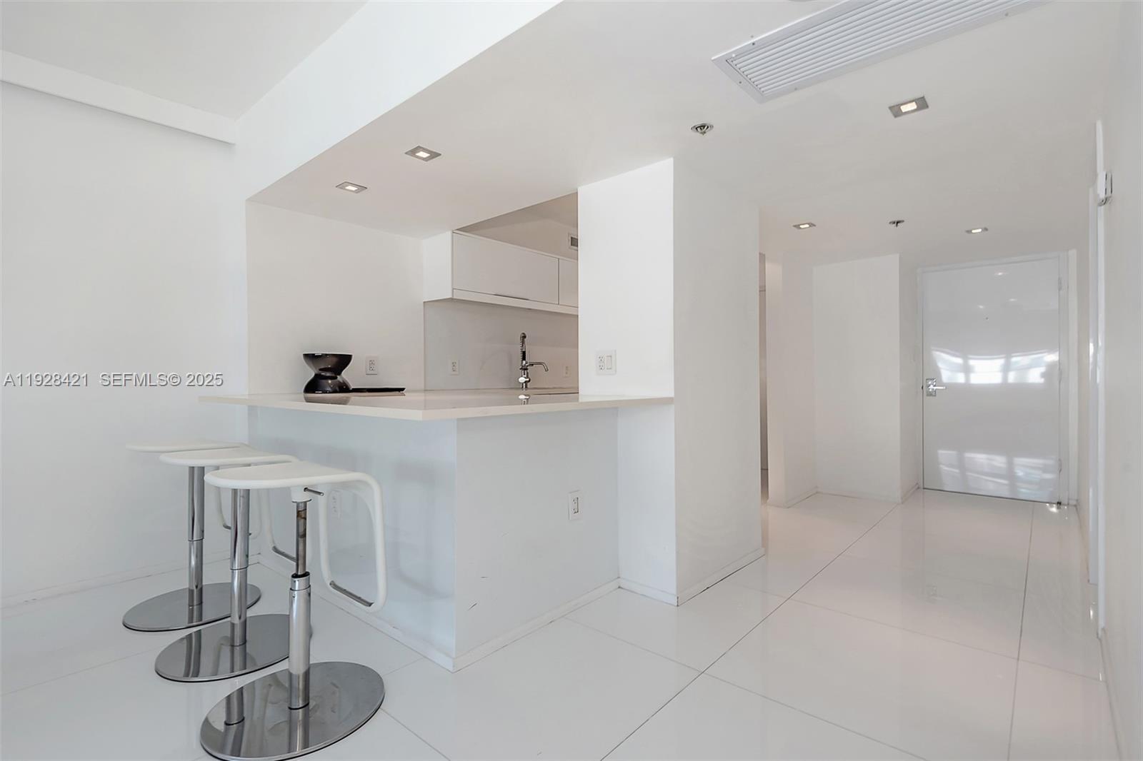 100 Lincoln Road, Unit 839 Miami Beach, FL 33139 - Photo 3 of 26 a bathroom with a sink a toilet and shower