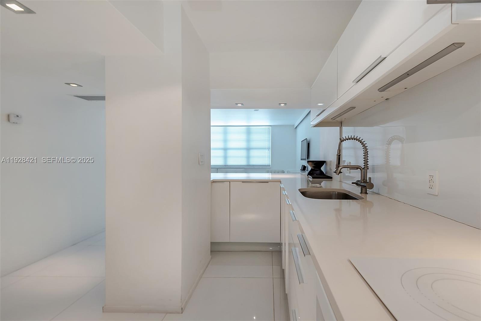 100 Lincoln Road, Unit 839 Miami Beach, FL 33139 - Photo 9 of 26 a bathroom with a sink and mirror