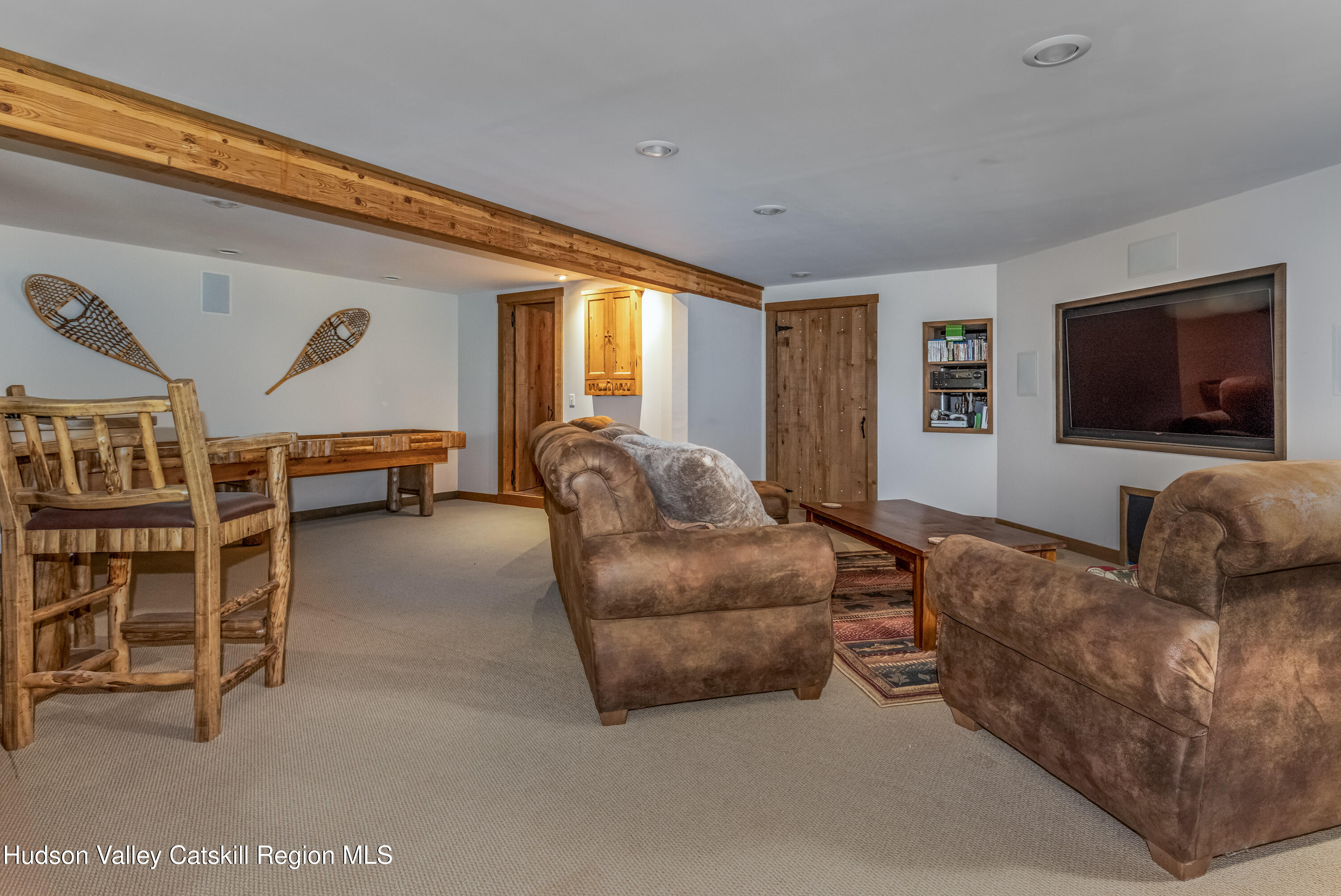 688 Bruce Porn Road Gilboa, NY 12167 - Photo 88 of 104 a living room with furniture and a flat screen tv