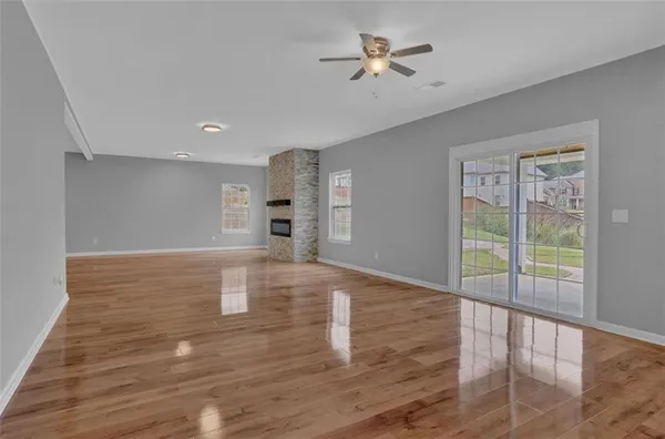 a view of kitchen and hall with wooden floor