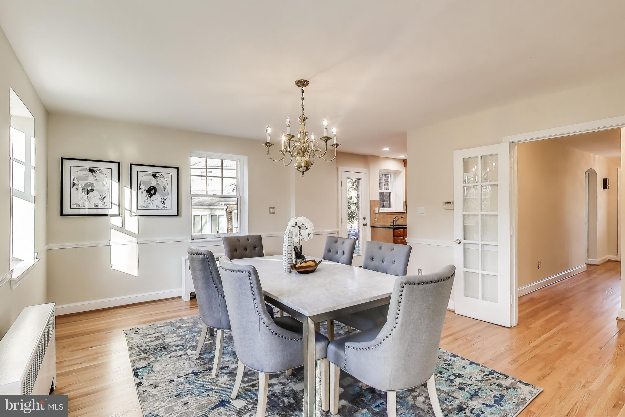 9214 Kingsbury Drive Silver Spring, MD 20910 - Photo 16 of 67 a view of a dining room with furniture and wooden floor