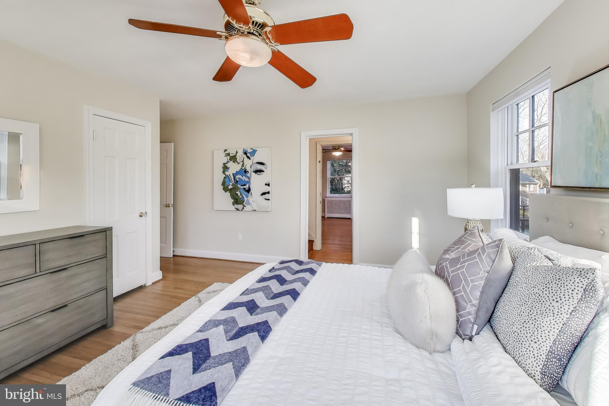 9214 Kingsbury Drive Silver Spring, MD 20910 - Photo 22 of 67 a bedroom with a bed and a chandelier