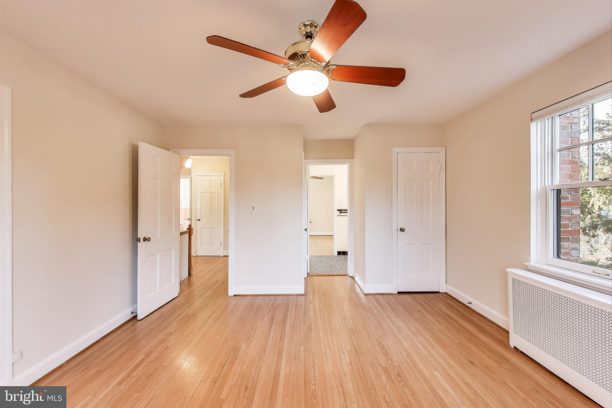 9214 Kingsbury Drive Silver Spring, MD 20910 - Photo 25 of 67 a view of empty room with wooden floor and fan