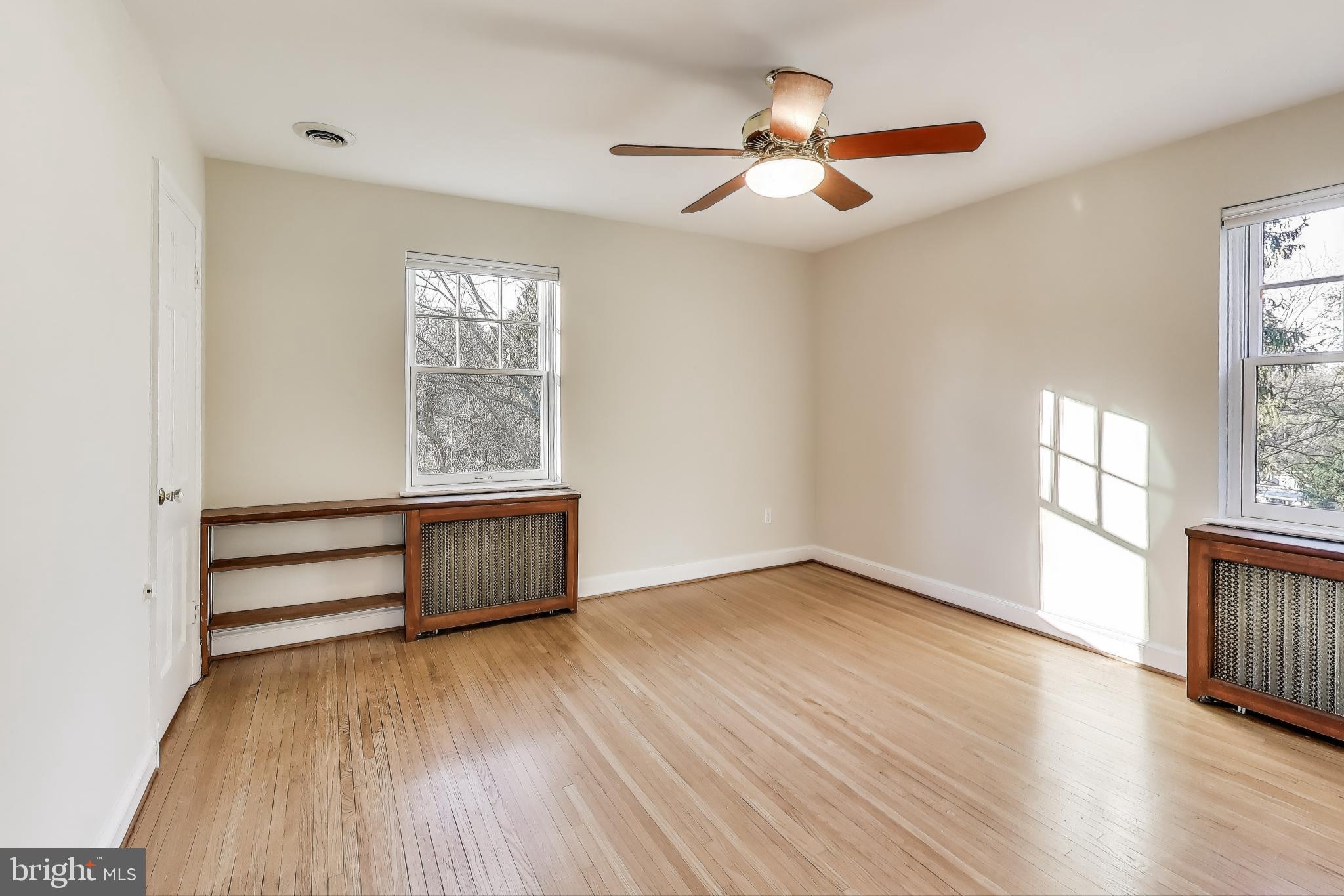 9214 Kingsbury Drive Silver Spring, MD 20910 - Photo 28 of 67 wooden floor in an empty room with a window