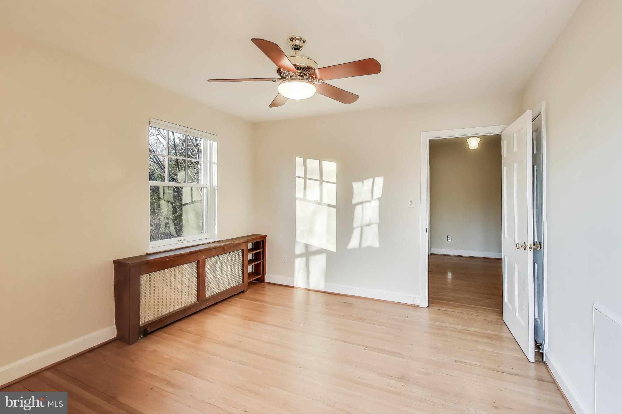 9214 Kingsbury Drive Silver Spring, MD 20910 - Photo 31 of 67 wooden floor in an empty room with a window