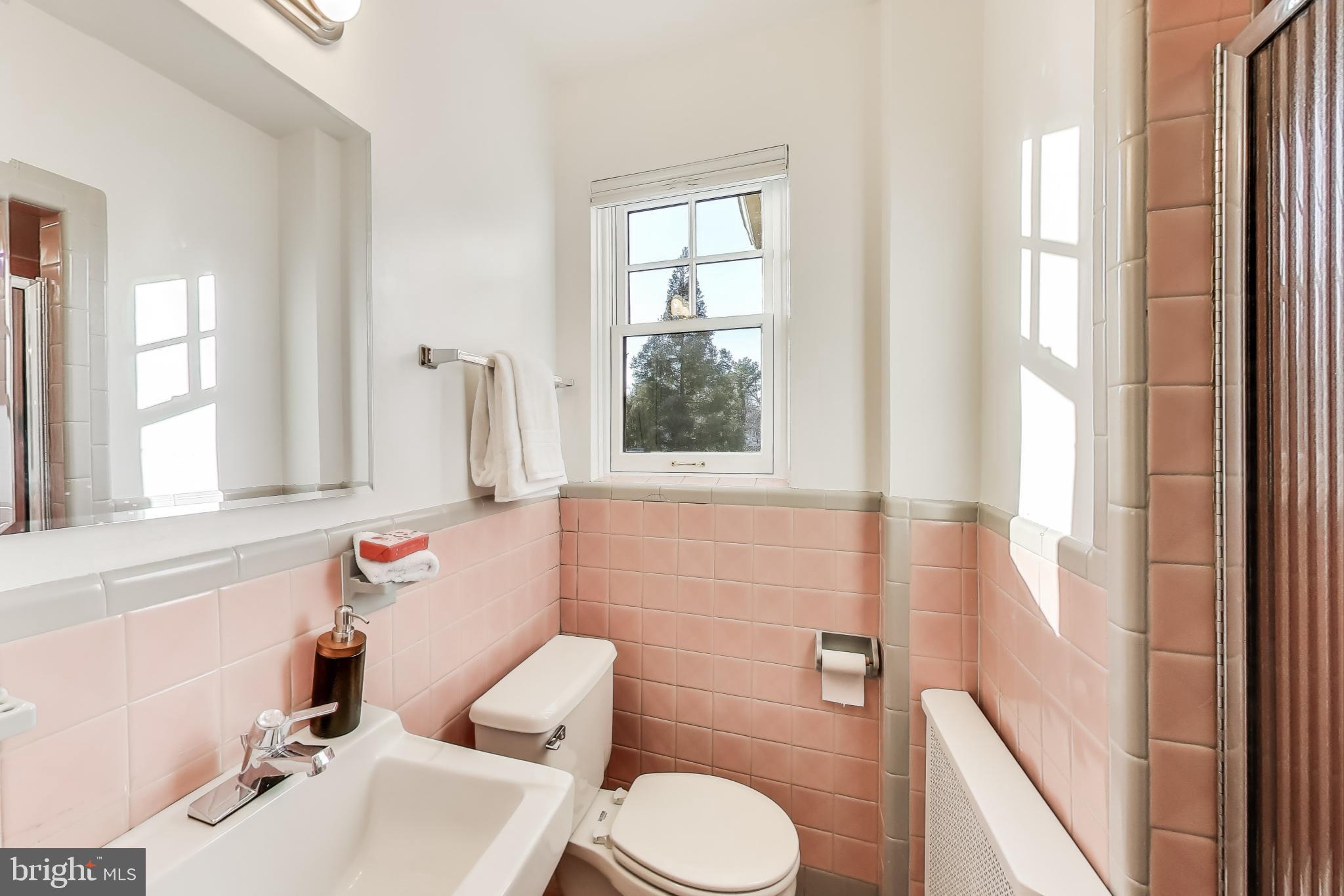 9214 Kingsbury Drive Silver Spring, MD 20910 - Photo 34 of 67 a bathroom with a sink mirror and toilet