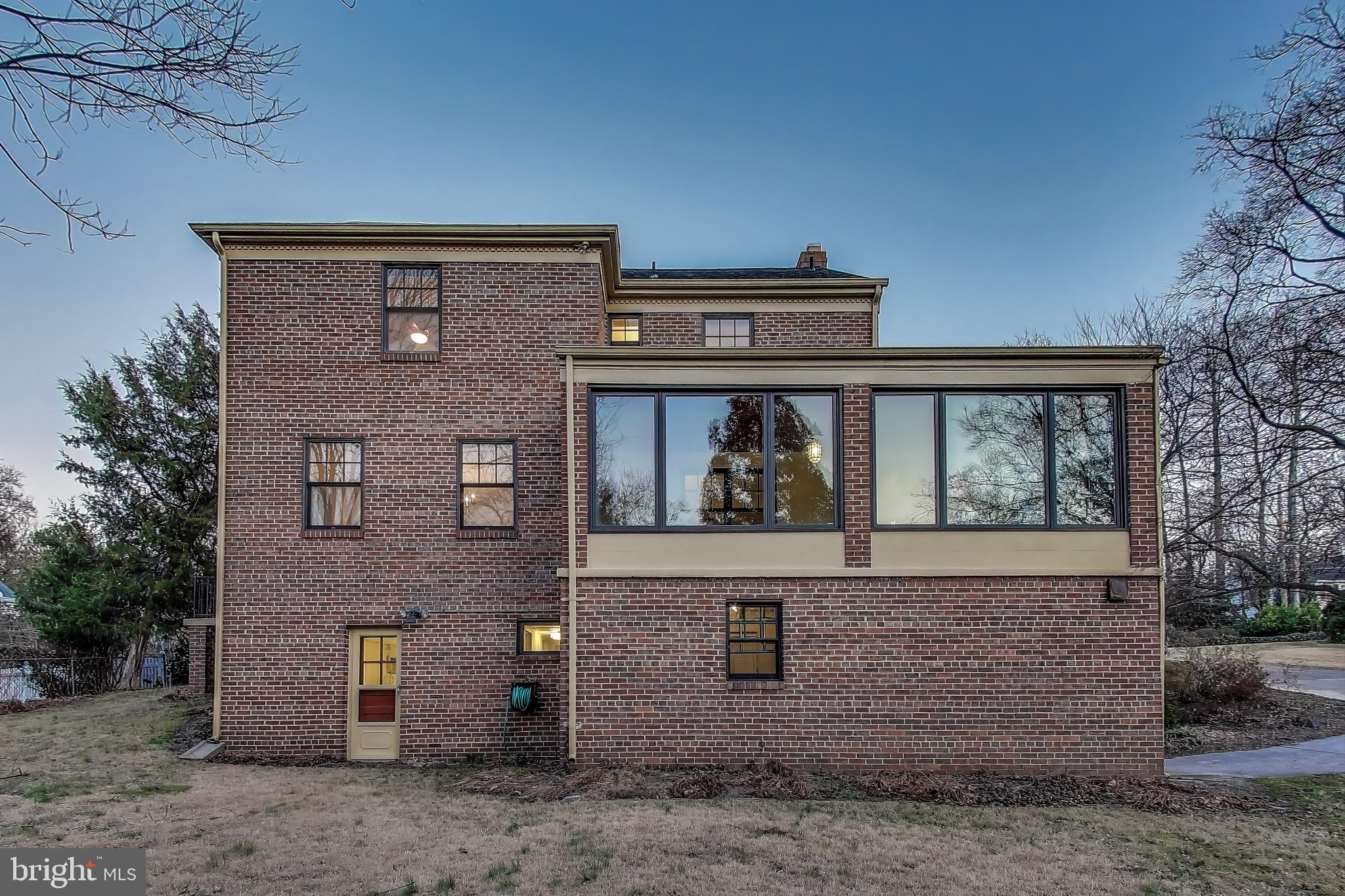 9214 Kingsbury Drive Silver Spring, MD 20910 - Photo 56 of 67 a front view of a house with garden