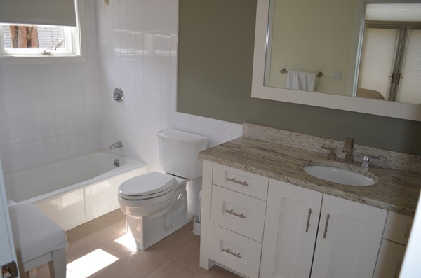 11 Elizabeth Road Marblehead, MA 01945 - Photo 13 of 29 a bathroom with a granite countertop sink a toilet and a mirror