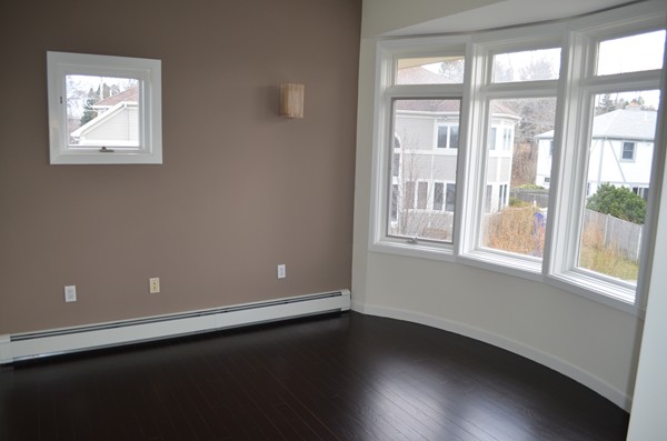 11 Elizabeth Road Marblehead, MA 01945 - Photo 21 of 29 a view of an empty room with wooden floor and a window