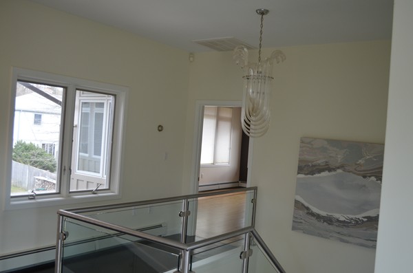 11 Elizabeth Road Marblehead, MA 01945 - Photo 23 of 29 a room with a chandelier fan and windows