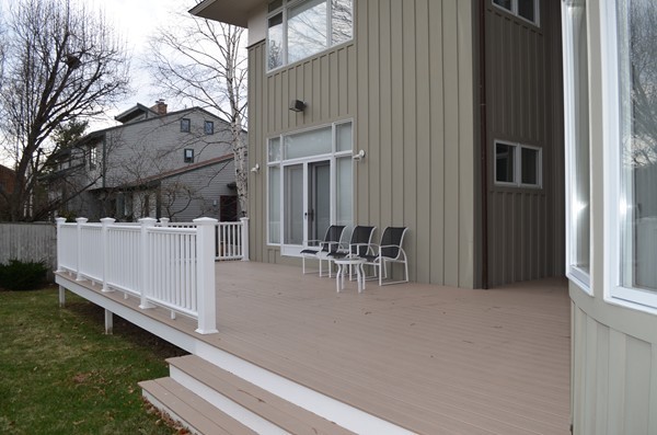 11 Elizabeth Road Marblehead, MA 01945 - Photo 27 of 29 a view of a patio with table and chairs and couches with wooden floor and fence