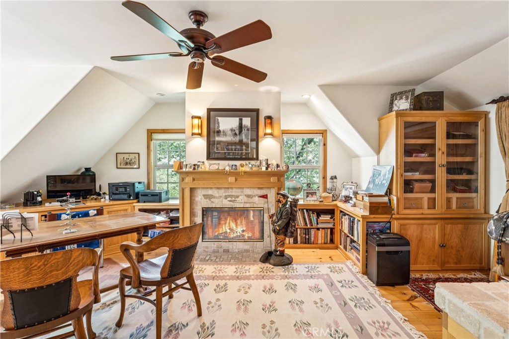 28971 North Shore Road Lake Arrowhead, CA 92352 - Photo 45 of 60 a dining room with furniture and wooden floor