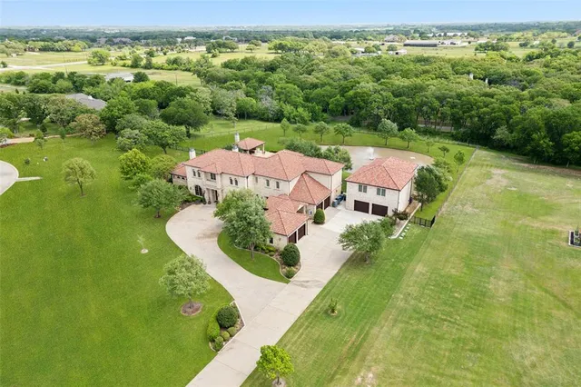 an aerial view of a house with a garden