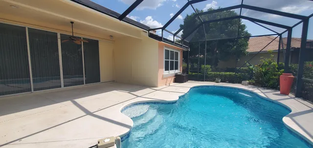 a bedroom with a bed and lamp