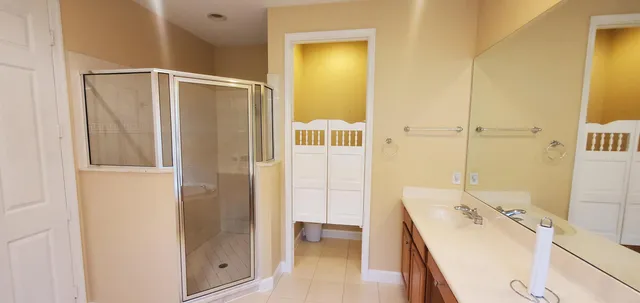 a utility room with cabinets washer and dryer