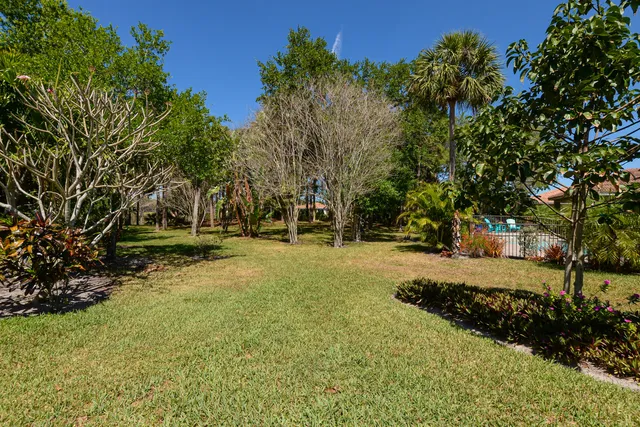 a living room with lots of furniture and a chandelier