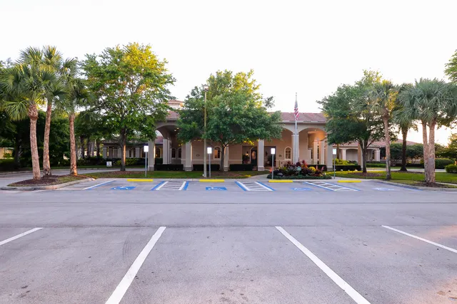 a large white kitchen with cabinets and stainless steel appliances