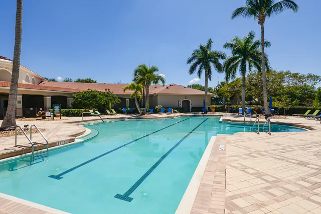 a view of a lake with houses in the back
