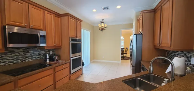 a living room with furniture and a ceiling fan