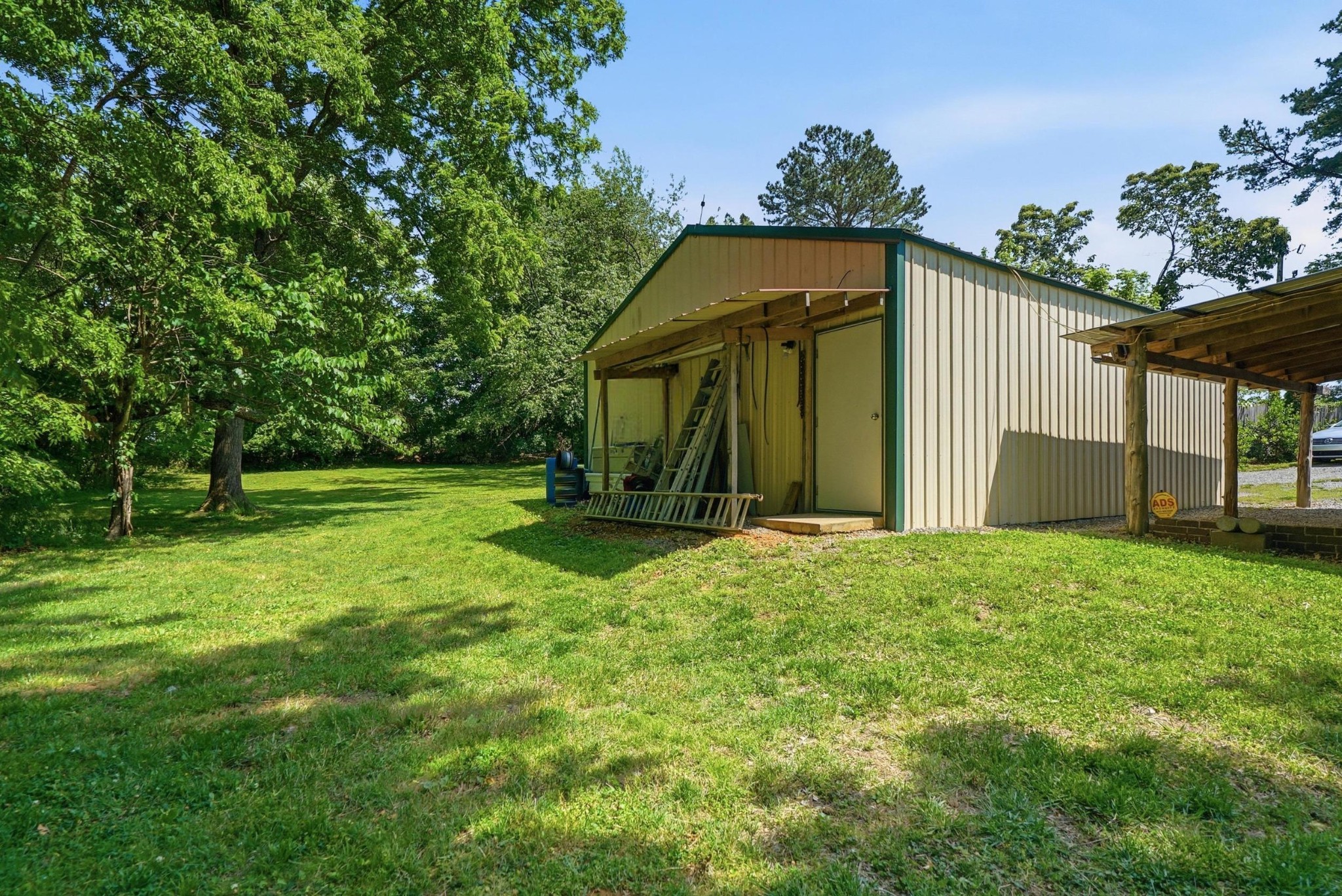 6471 Highway 161 Springfield, TN 37172 - Photo 45 of 57 a view of a tiny house with yard and a tree