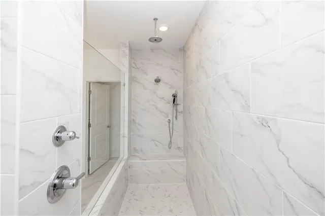 a bathroom with a sink and shower