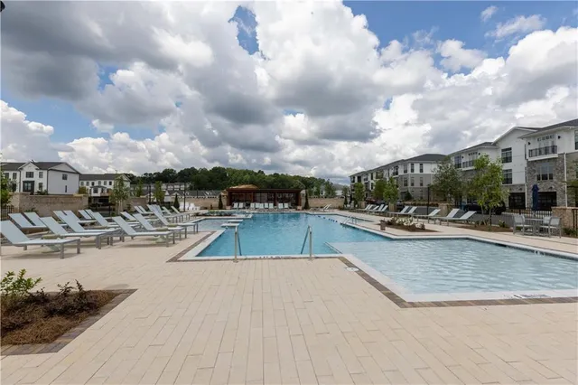 a view of a swimming pool and a lot of buildings