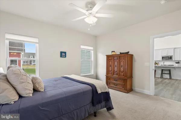 a bedroom with a bed and a desk