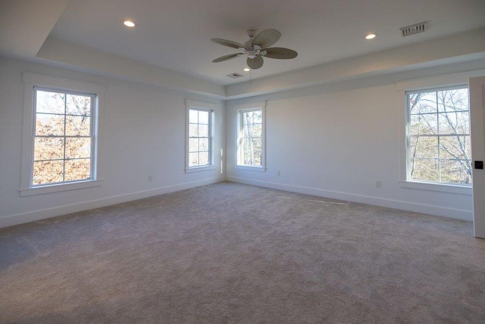 12370 Creamery Road Hopewell Junction, NY 12533 - Photo 20 of 26 Spare room with ceiling fan, a tray ceiling, and carpet floors